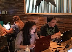 Students and professionals working at CloudWise Academy